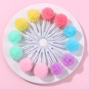 Lot de 12 barrettes à cheveux à pompons en tulle couleurs macaron disposées en cercle