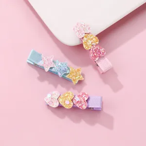 Glitter heart and star hair clips set in pink, blue, and purple for girls