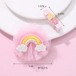 Detail of pink mesh rainbow hair clip and glitter hearts set with size measurements