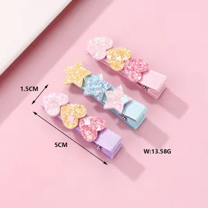 Detailed view of 5cm glitter heart and star hair clips with size and weight measurement