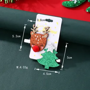 Détails de barrettes de Noël avec renne et sapin pailletés sur carte festive