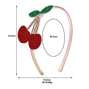 Gold glitter headband for girls with sparkly red cherry and green leaf decorative accents