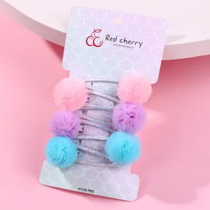 Set de 6 barrettes à cheveux pompons colorés avec clips en métal pailletés