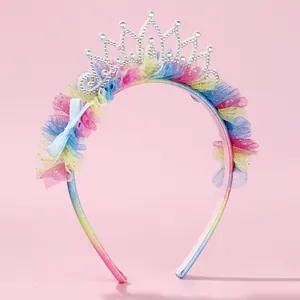 Girl's princess headband with rainbow mesh ruffles and a sparkling silver crown decor