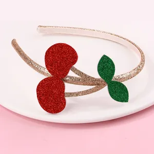 Sparkly sequin cherry headband for girls with gold glitter fabric on a pink background