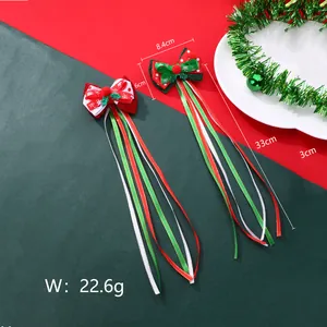 Barrettes de Noël avec longs rubans, montrant les dimensions et le tissu pailleté