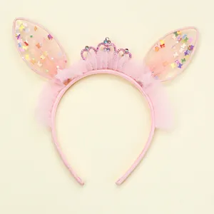 Close-up of pink mesh rabbit ears hairband with sequin crown and non-slip design