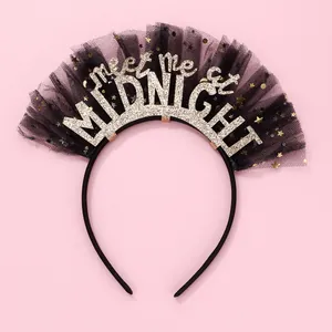Detail of black mesh headband featuring gold glitter meet me at MIDNIGHT text and stars