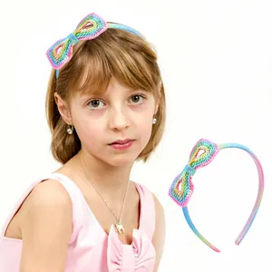 Rainbow sequin headband for girls featuring a large bow and non-slip design