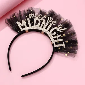Detail of midnight party headband with gold glitter text, black mesh, and stars