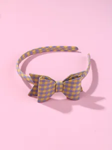 Detailed view of yellow and purple gingham fabric headband with a sweet bow knot design