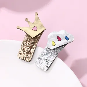 Sparkling crown and cloud sequin hair clips set with gold and silver glitter texture