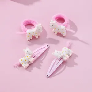 Pink unicorn hair clips and elastic hair ties set for kids with glitter and tassel details
