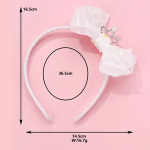 White children's headband with large organza bow and crystal crown pearl decoration