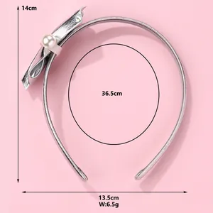 Shiny silver PU leather headband with bow and pearl detail, size 14cm by 13.5cm