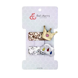 Glitter crown and cloud hair clips for girls set of 2 on a white display card