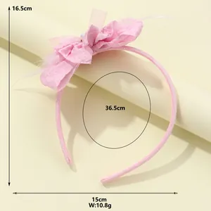 Pink fabric floral headband for kids with soft feathers and dimensions 16.5x15cm