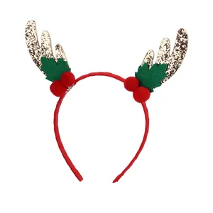 Christmas reindeer antler headband with festive red pom poms and golden glitter