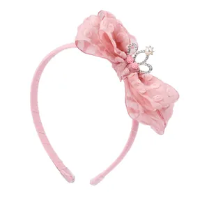 Pink girls' headband featuring a layered organza bow and small crown with pearls