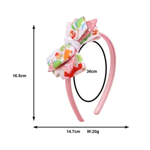 Cerchietto rosa con fiocco dinosauro che mostra dimensioni 16,5 cm di altezza e 14,7 cm di larghezza