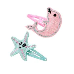 Fermagli per capelli marini glitterati con delfino rosa e stella marina blu