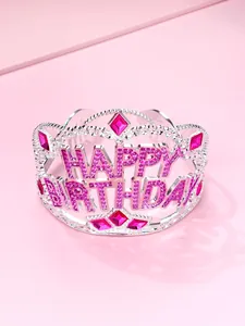 Macro view of silver Happy Birthday crown with pink rhinestones and hollow lettering