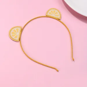 Yellow lemon embroidery headband for girls featuring sparkling fruit details on pink backdrop
