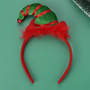 Detail view of a green velvet elf hat headband with red feathers and a small gold bell
