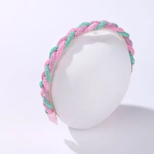 Detail of pink, purple, and green glitter braided headband with protective soft fabric ends