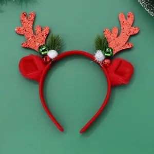 Detail of Christmas reindeer antler headband with red sequins, bells, and faux fur
