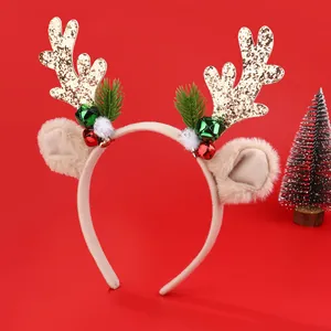 Glittering Christmas reindeer antler headband with bells on a festive red background