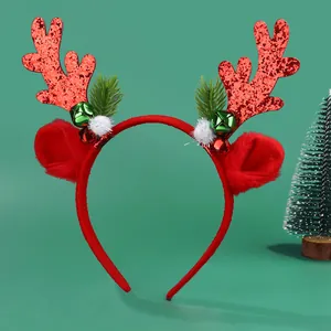 Detail of Christmas reindeer antler headband with sequins, bells, and faux fur ears