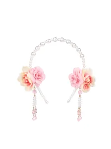 Detail of floral headband with white pearls and delicate pink fabric rose tassels