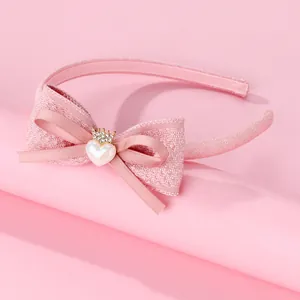 Serre-tête rose pour enfants avec nœud pailleté et détail couronne en cœur nacré