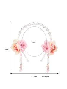 Detail view of floral headband with pearls and pink tassels showing product dimensions