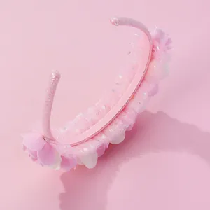 Pink floral hairband for girls with sweet mesh lace and sparkly sequins on pink background