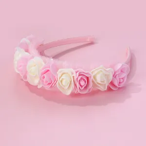 Detailed view of pink rose flowers and mesh lace on a sweet princess headband
