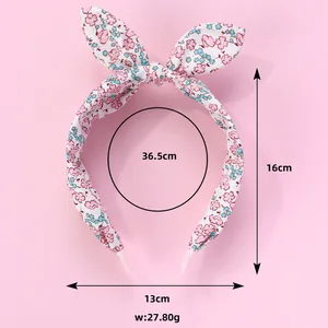 Floral rabbit ear headband for girls in pink fabric with dimensions 16x13cm