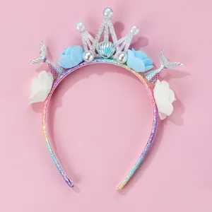 Detail of sparkling mermaid crown headband with glitter fish tails and foam roses