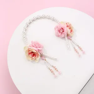 Elegant floral headband with pearls and pink silk tassels for traditional costumes
