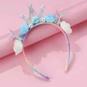 Detailed view of mermaid headband with glitter crown, fish tails and soft fabric flowers