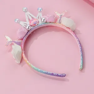 Detail of mermaid crown headband with glitter, pearls, shells and rainbow fabric flowers