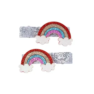 Pair of glittery rainbow and cloud hair clips with silver sequin rectangular base
