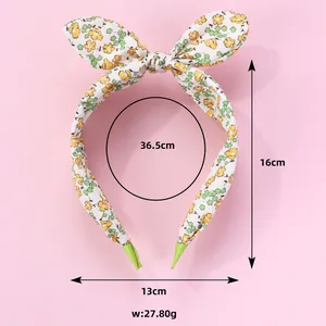 Detailed size specifications of the floral bow headband with 13cm width and 27.8g weight