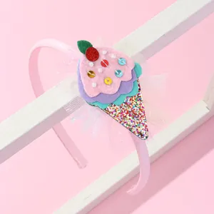 Detail of pink children headband with sequin ice cream motif and mesh lace trim