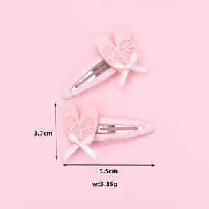 Juego de dos pinzas para el cabello de bailarinas con purpurina rosa y lazos