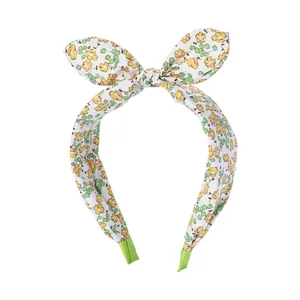 Floral print wide headband with bow design and yellow flower patterns for girls
