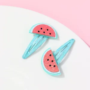 Detailed close-up of glitter watermelon hair clips for kids with non-slip BB clip base