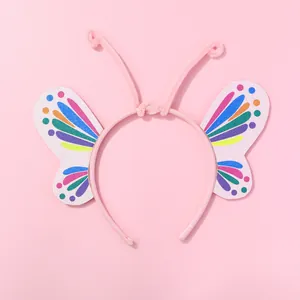Diadema de mariposa colorida para niñas con pompones rosas y alas con purpurina