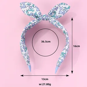 Floral fabric headband detail showing dimensions and anti-slip rubber tips for kids